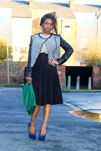 High waist black accordion pleated skirt, leather sleeves tweed jacket, blue suede heels & oversized envelop clutch