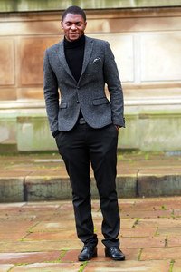 Men's Turtleneck or roll neck with an unpatterned tweed blazer & black smart trousers