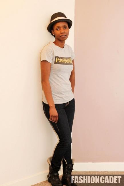 T-shirt, jeans, fedora hat, bangles & black biker boots