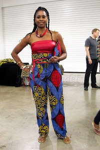 ‘Ankara’/’kitenge’/African print belted wide leg boobtube jumpsuit with a matching clutch bag & flat sandals. Ankara/’kitenge’ mixed with silk fabric