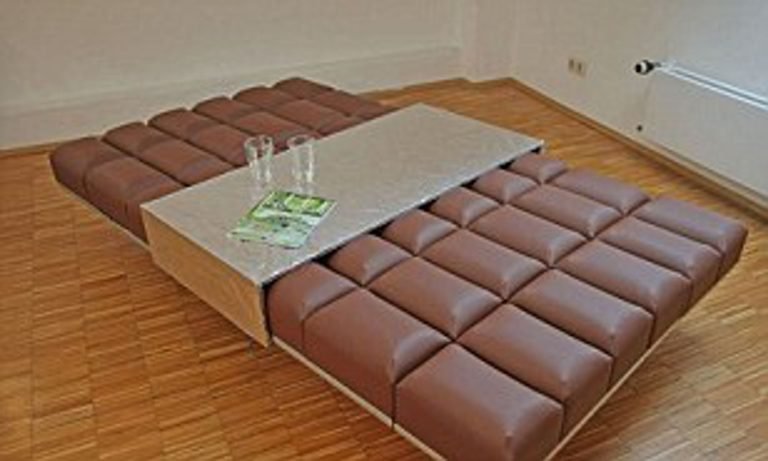 A sofa that looks like a giant chocolate bar