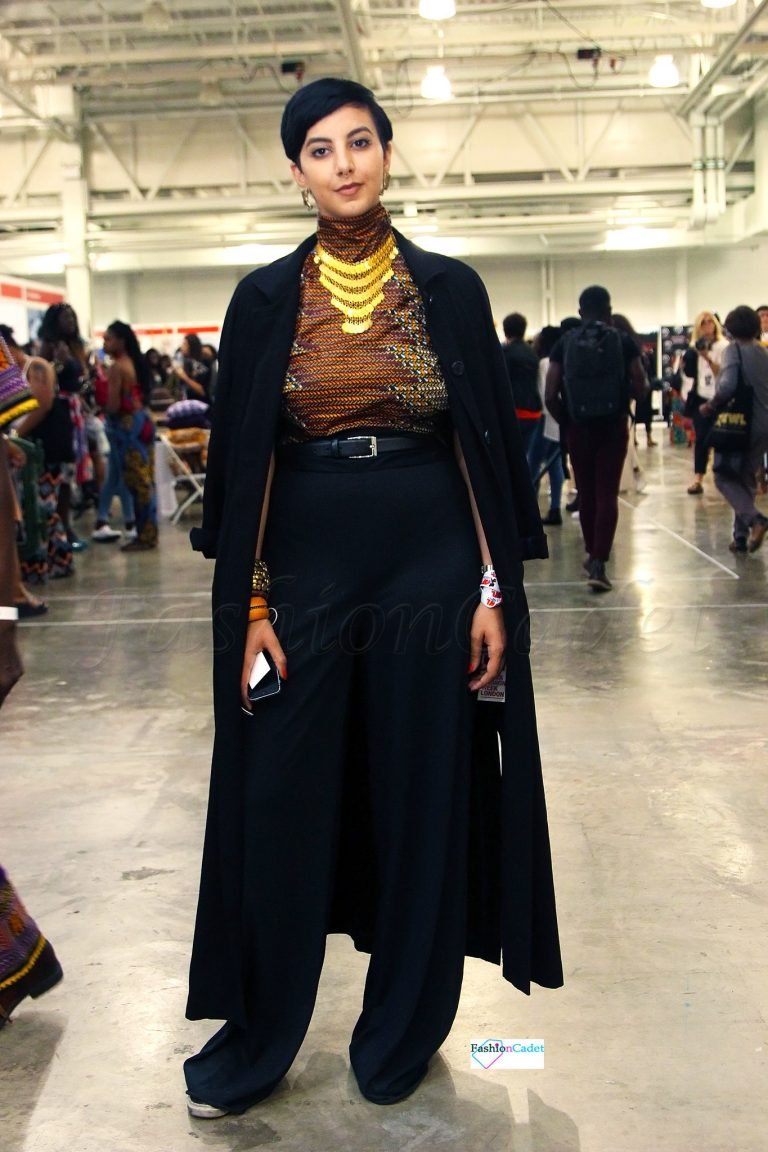 Ankara/kitenge/chitenge/African print High neck top with black high waist wide leg loose pants, black over the shoulder long coat, gold statement necklace and bangles