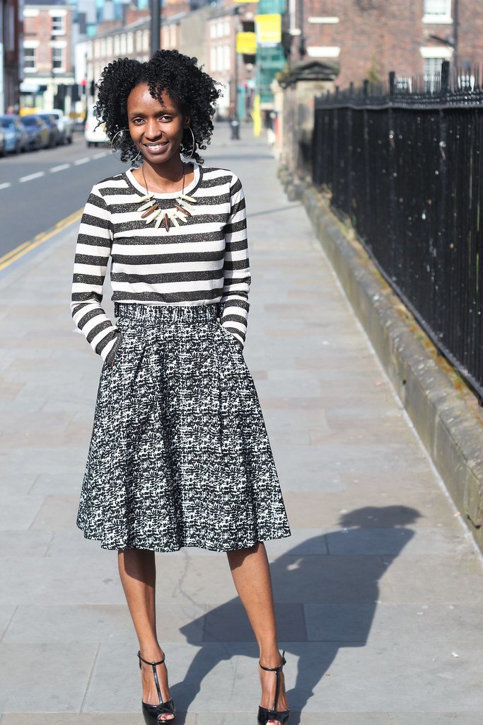 Striped sweater, monochrome A-line midi length skirt & heels